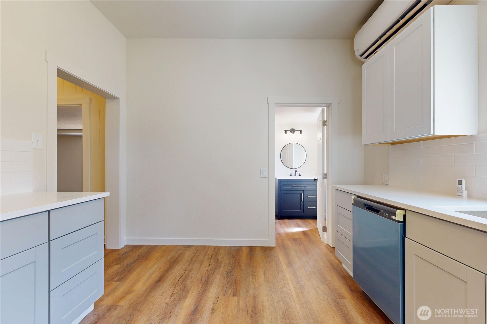 611 Southwest 3rd Street Pendleton, OR 97801 - Photo 8 of 21 a kitchen with granite countertop a sink cabinets and wooden floor