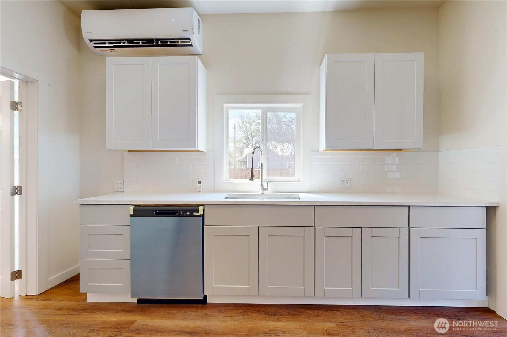 611 Southwest 3rd Street Pendleton, OR 97801 - Photo 9 of 21 a kitchen with stainless steel appliances granite countertop a sink cabinets and wooden floor