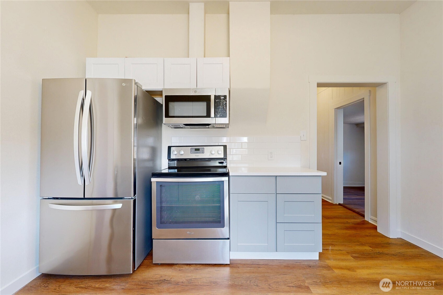 611 Southwest 3rd Street Pendleton, OR 97801 - Photo 10 of 21 a kitchen with stainless steel appliances a refrigerator stove and microwave