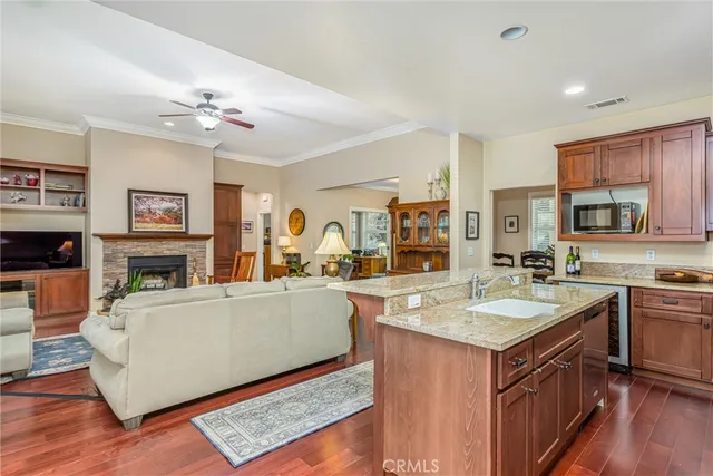 a view of a kitchen counter top space with sink granite counter tops and a window