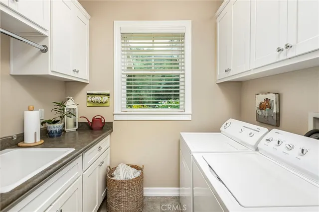 a kitchen that has a sink and a stove