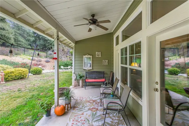 a bedroom with furniture and a potted plant