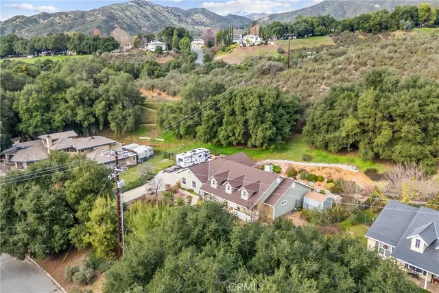 an aerial view of residential house with outdoor space