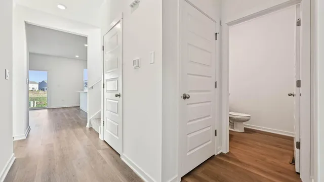 a view of a bathroom from the hallway