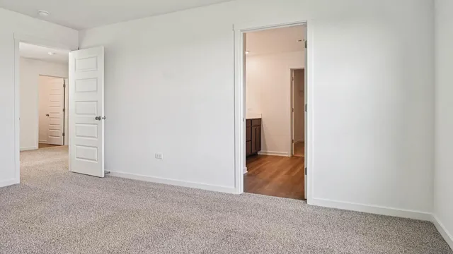 a view of an empty room and closet