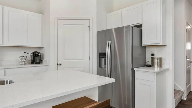 a kitchen with stainless steel appliances a refrigerator and a sink