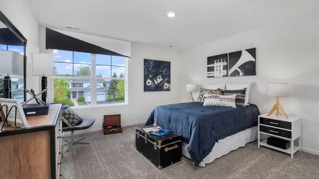 a bedroom with a bed and furniture