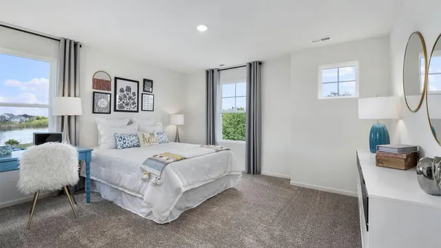 a bedroom with a bed and a chair