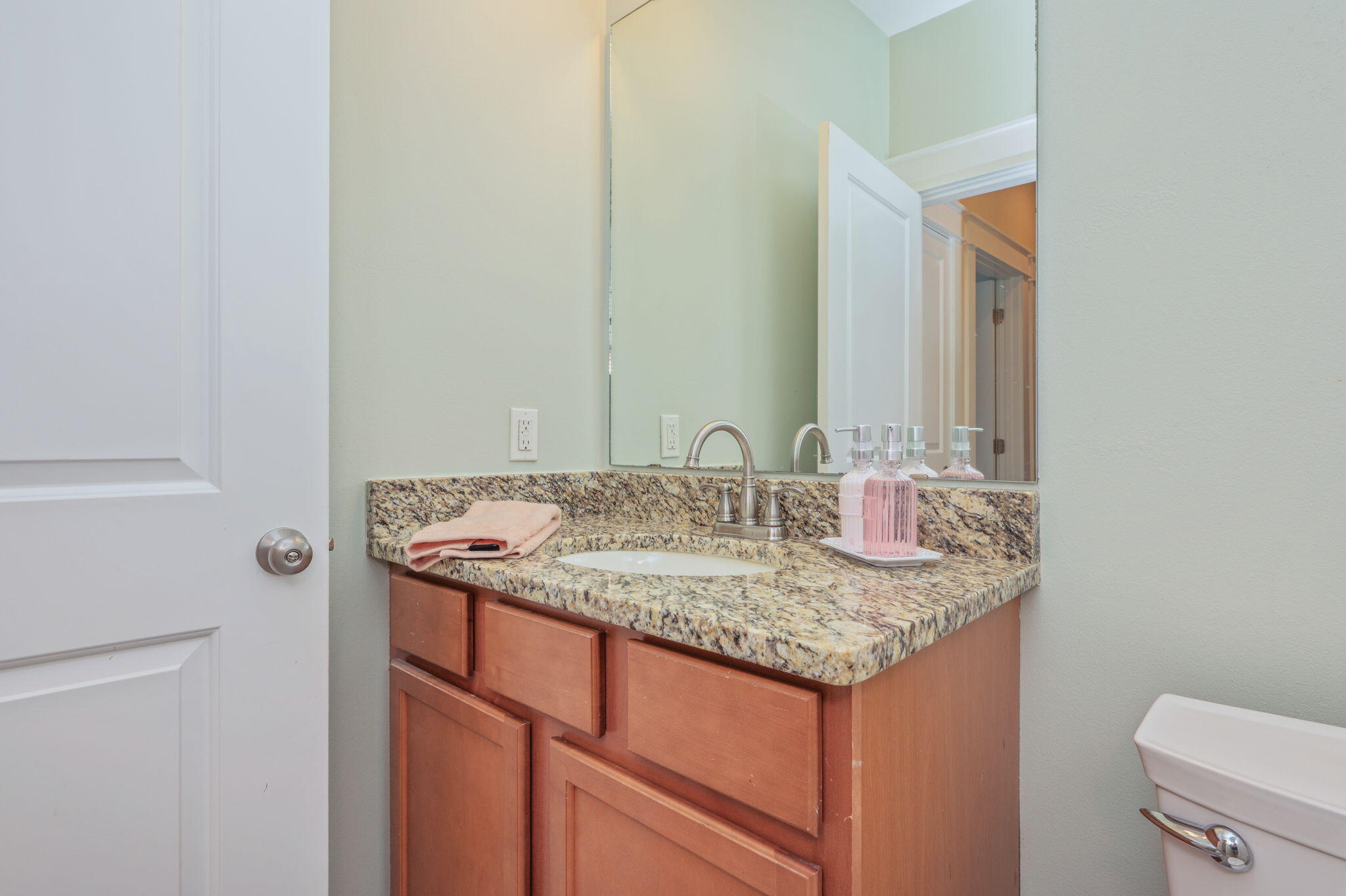 3120 Pinot Way Crestview, FL 32536 - Photo 28 of 37 a bathroom with a granite countertop sink and a mirror