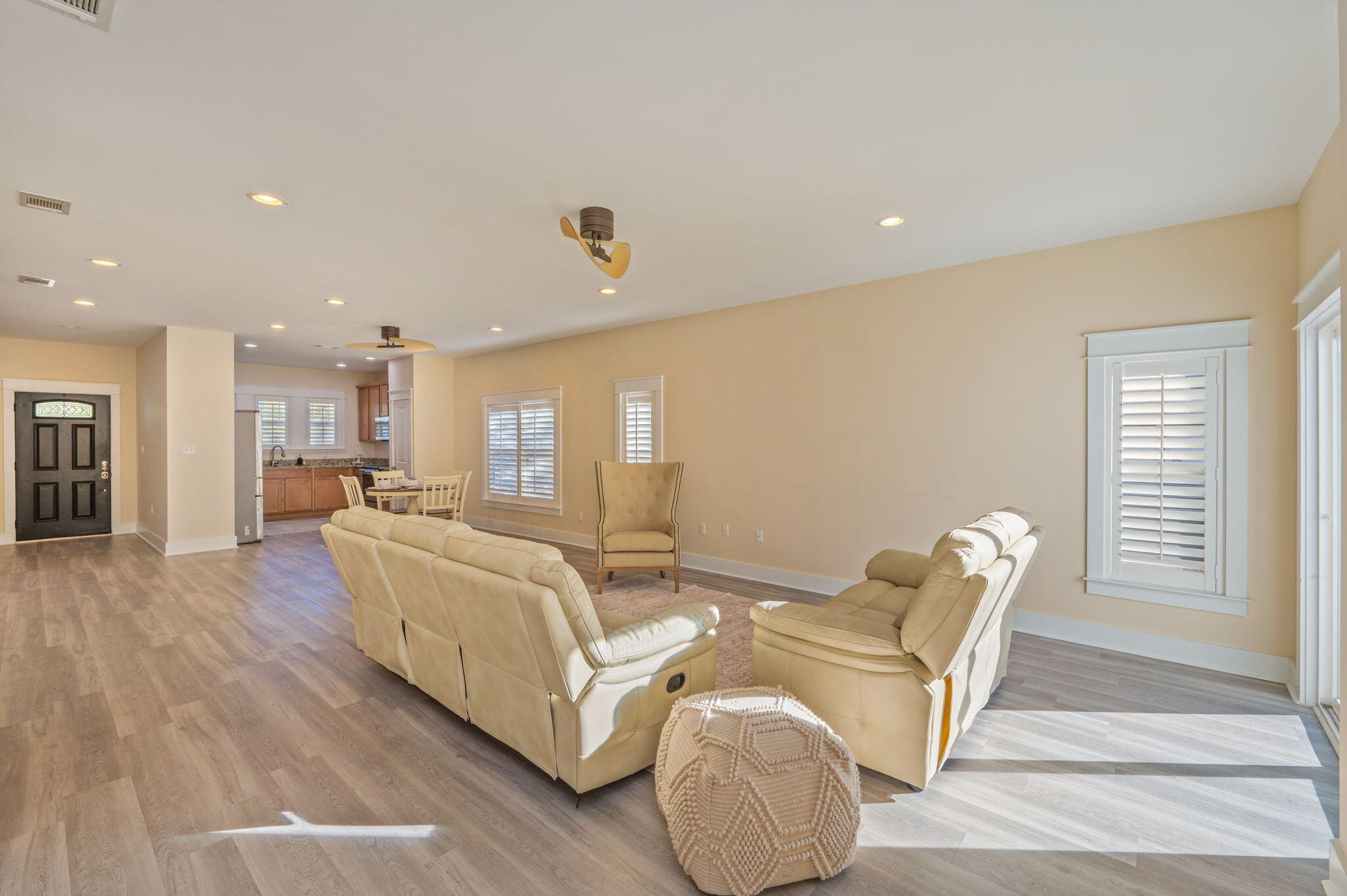 3120 Pinot Way Crestview, FL 32536 - Photo 3 of 37 a living room with furniture a wooden floor and a fireplace