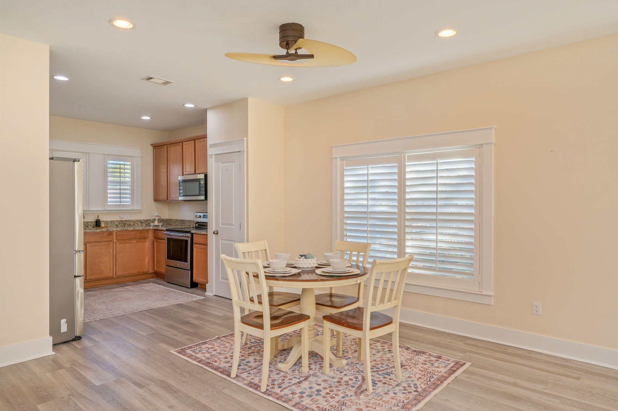 3120 Pinot Way Crestview, FL 32536 - Photo 5 of 37 a view of a dining room with furniture and wooden floor