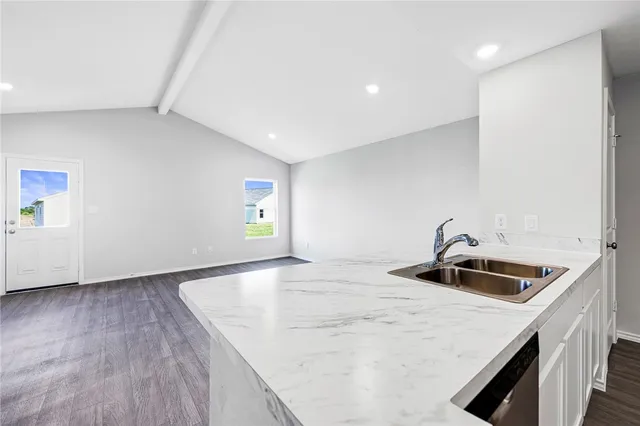a kitchen with a sink and cabinets