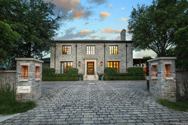 a front view of a house with yard