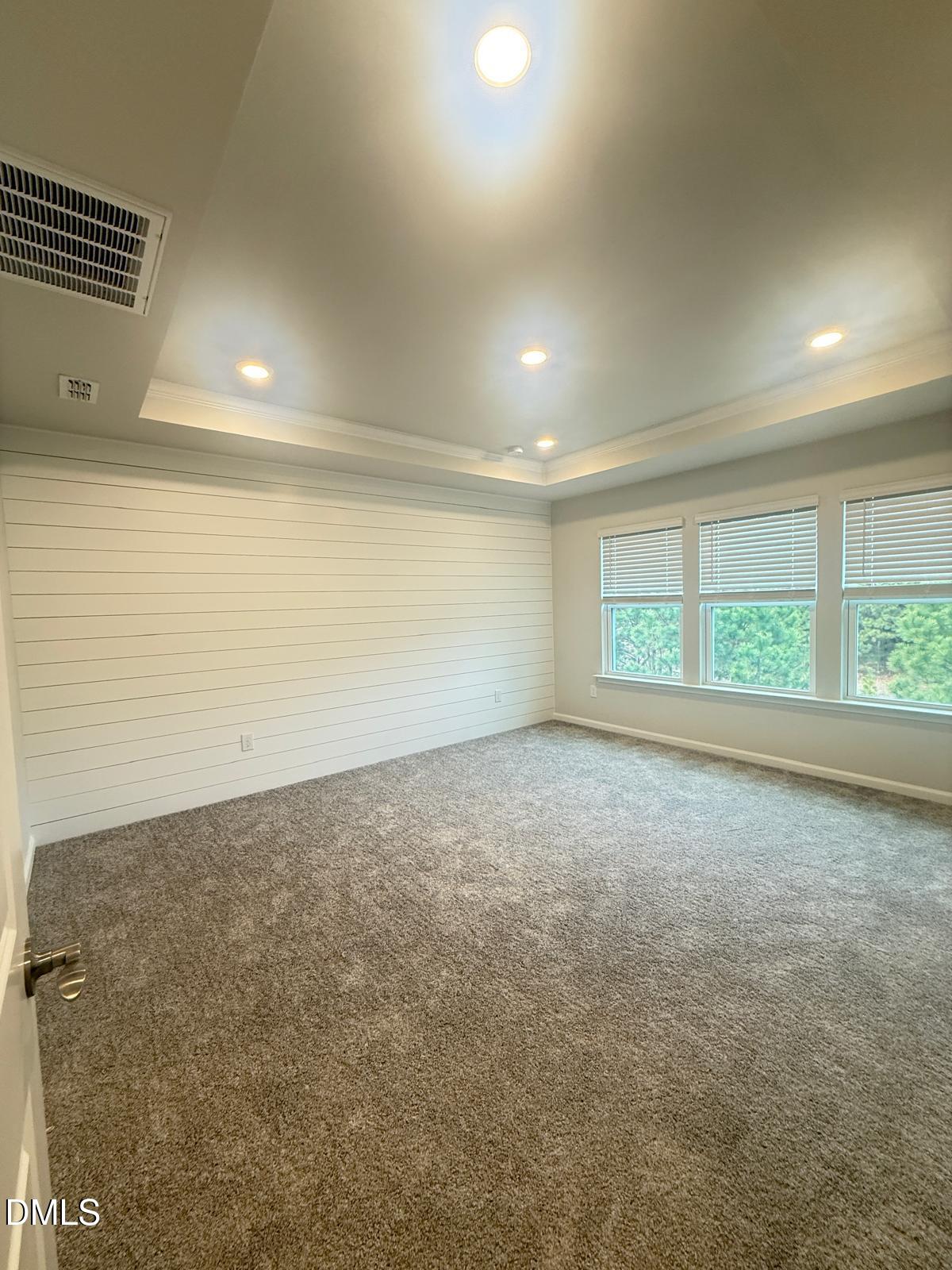 2126 Grubstake Street Apex, NC 27523 - Photo 11 of 22 an empty room with a empty space and windows