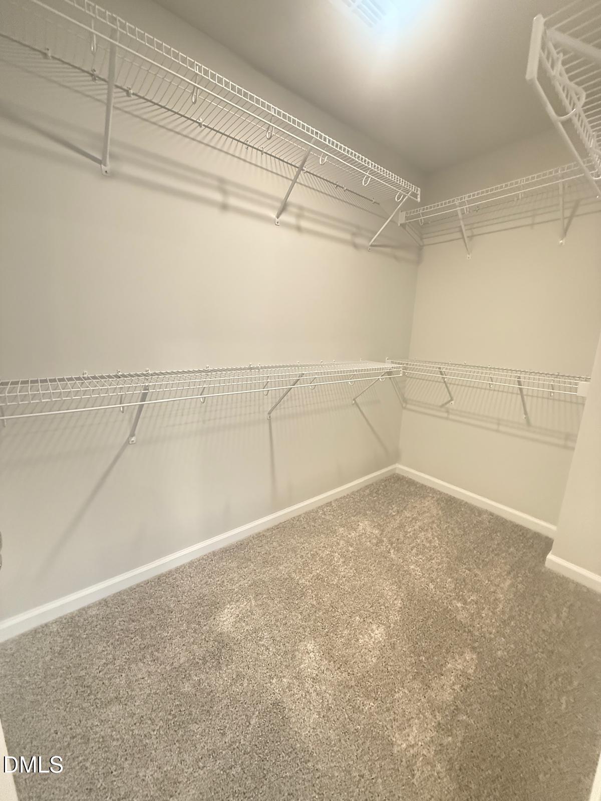 2126 Grubstake Street Apex, NC 27523 - Photo 14 of 22 a view of a room with racks on the wall