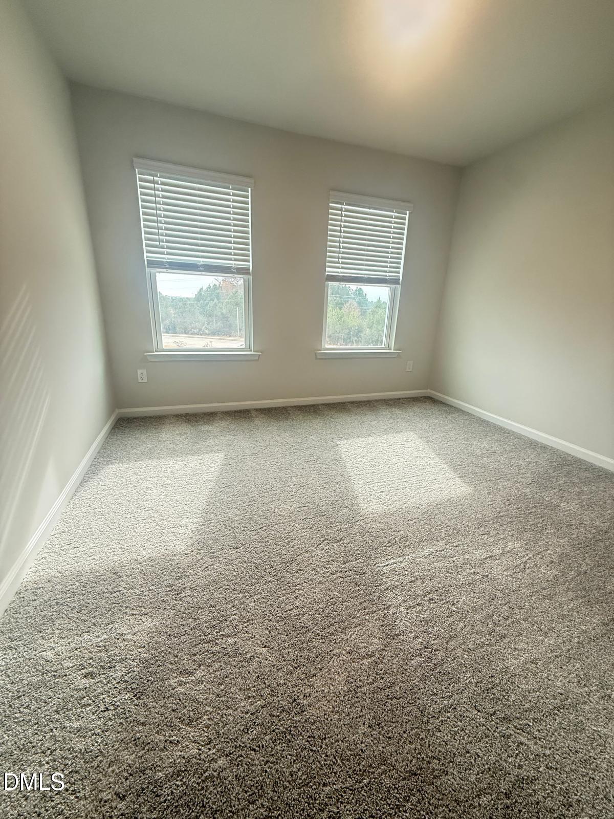 2126 Grubstake Street Apex, NC 27523 - Photo 16 of 22 an empty room with windows