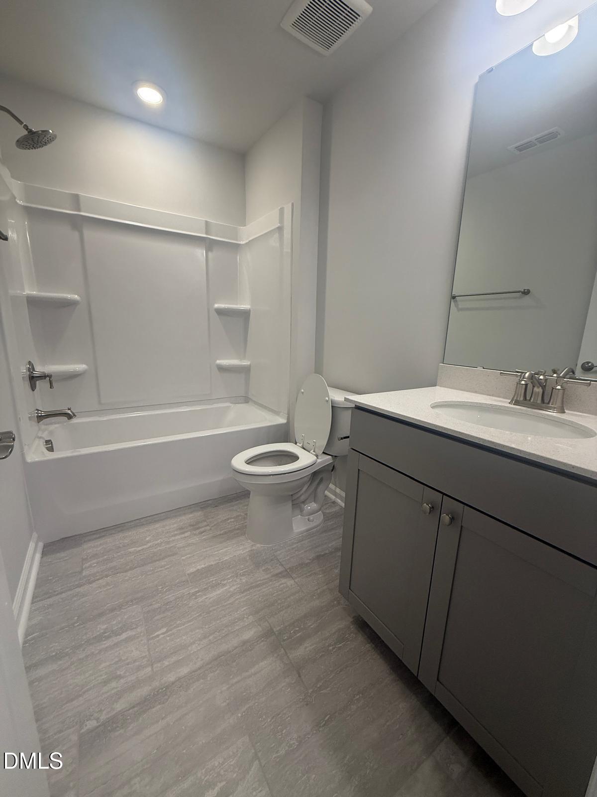 2126 Grubstake Street Apex, NC 27523 - Photo 17 of 22 a bathroom with a sink a toilet and shower