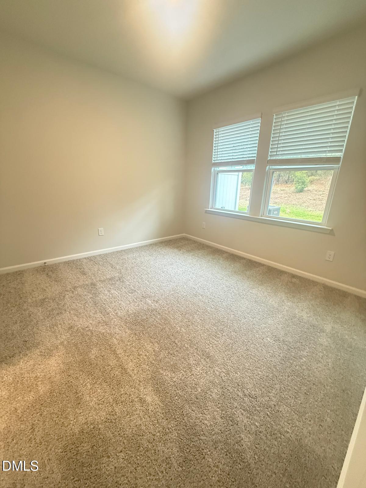 2126 Grubstake Street Apex, NC 27523 - Photo 20 of 22 an empty room with windows