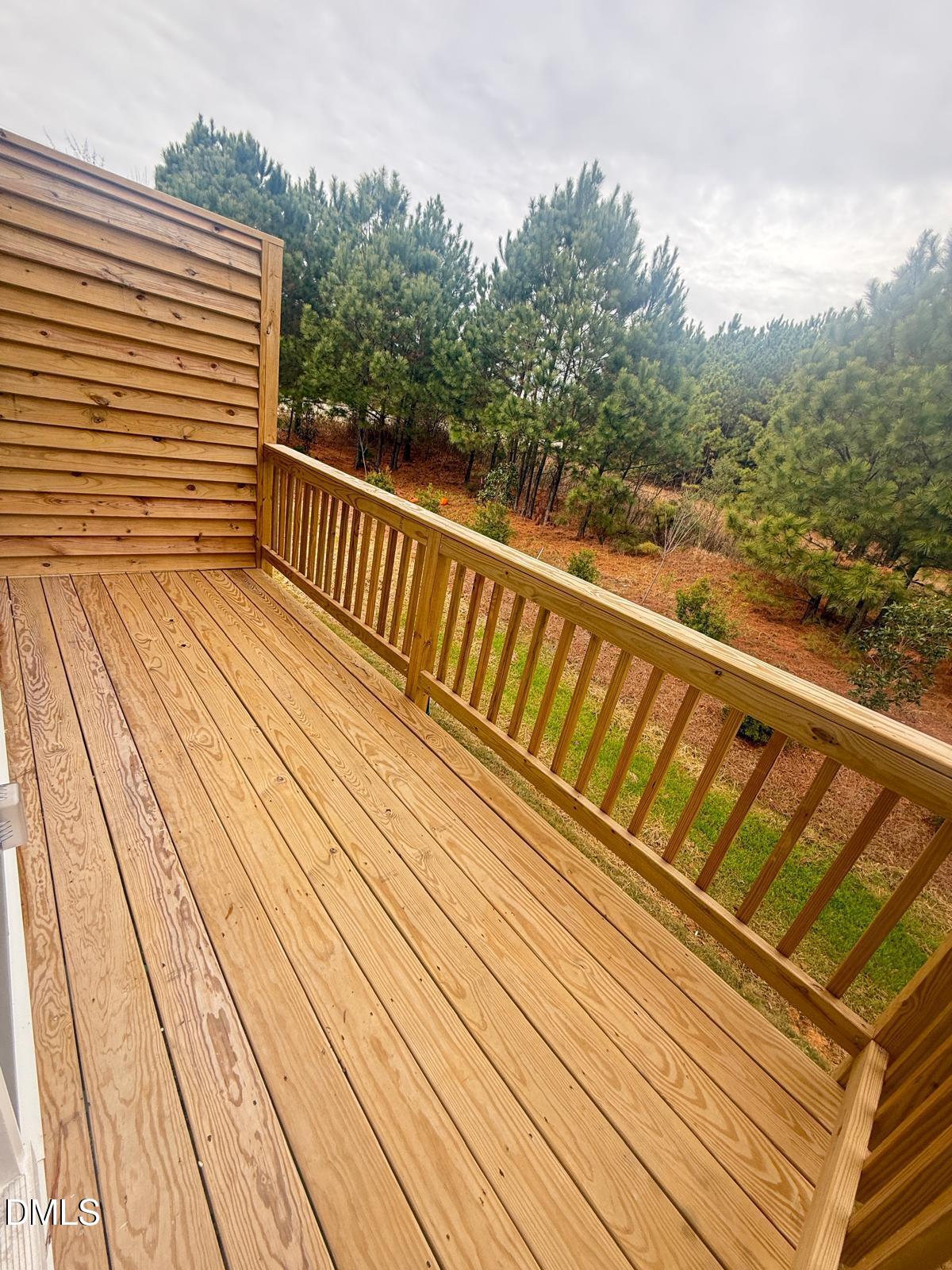 2126 Grubstake Street Apex, NC 27523 - Photo 7 of 22 a view of balcony with wooden floor and fence