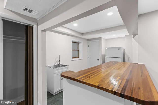 a room with a bed and mirror