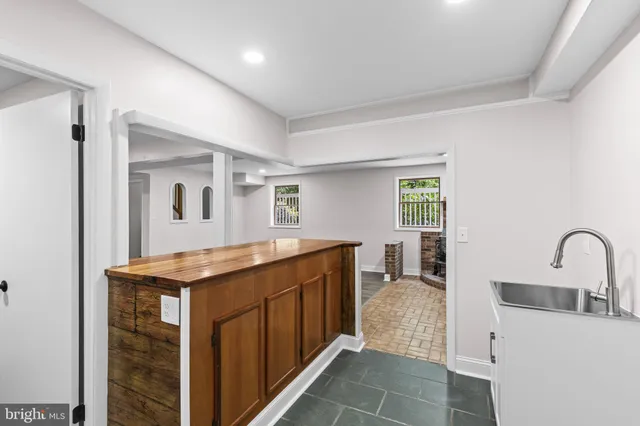 a kitchen with a sink and stove