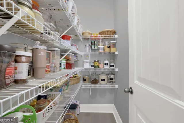 a bathroom with a sink vanity mirror and toilet