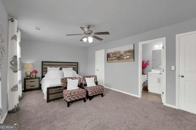 a bathroom with double sink and a mirror