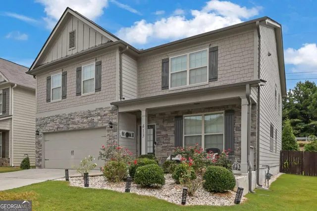 front view of a house with a yard