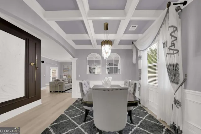 a dining room with furniture and window