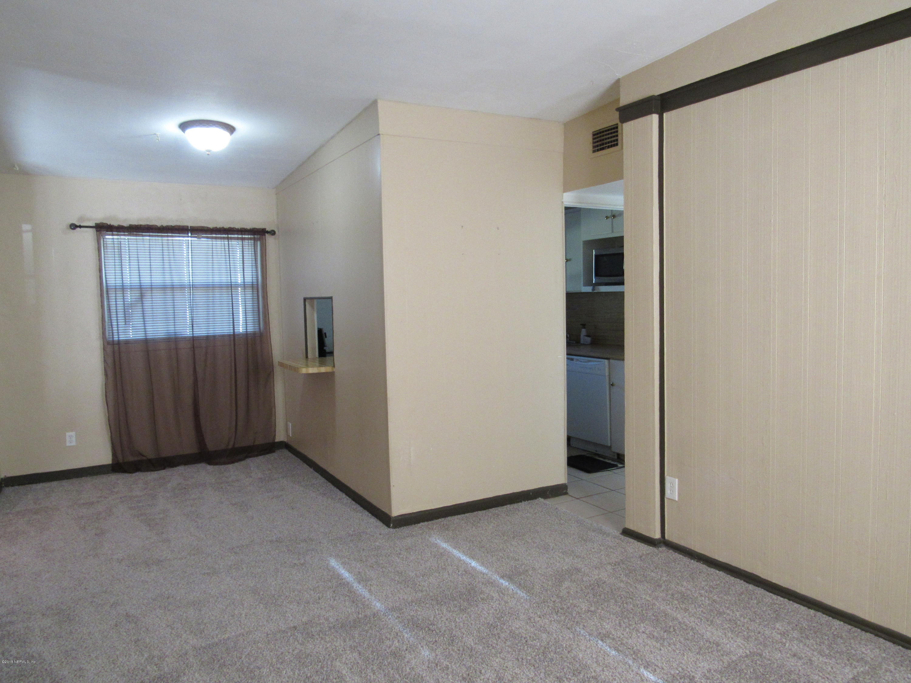 1401 Morgana Road Jacksonville, FL 32211 - Photo 5 of 11 a view of an empty room with a window