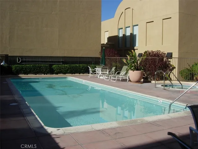 a view of table and chairs and potted plants