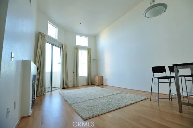 a spacious bedroom with a bed and a table in it