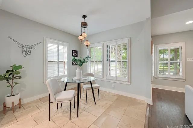 a view of a livingroom with furniture window and wooden floor