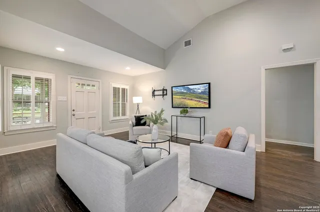 a living room with furniture and a window