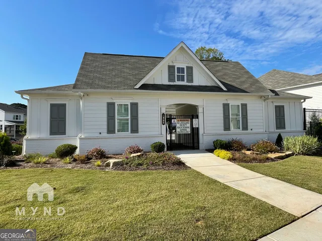 a swimming pool with outdoor seating and yard