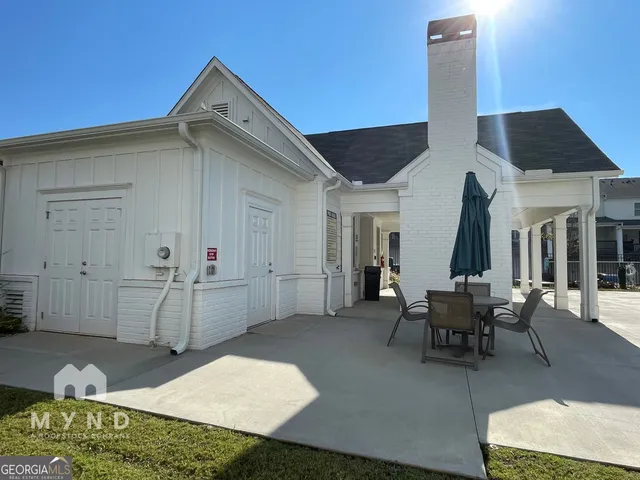 a view of a swimming pool with a lounge chairs