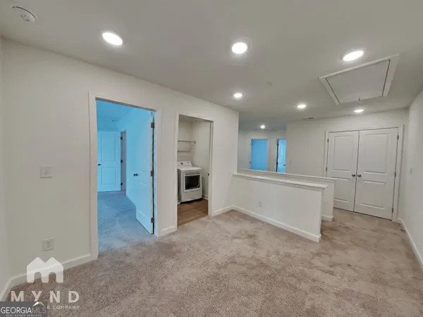 a view of a livingroom with a ceiling fan and window