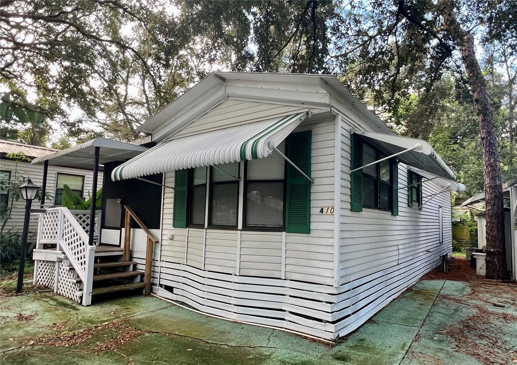 3000 Clarcona Road, Unit 410 Apopka, FL 32703 - Photo 1 of 11 a view of house with a outdoor seating