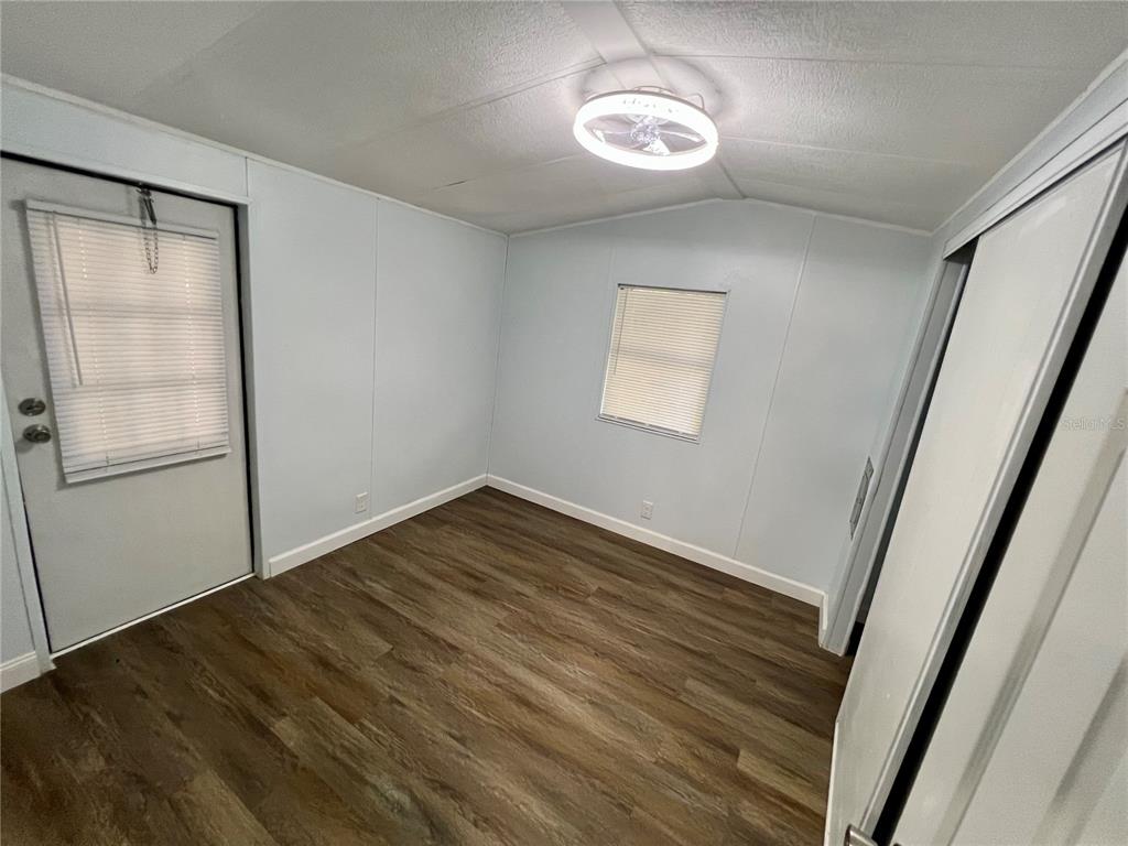 3000 Clarcona Road, Unit 410 Apopka, FL 32703 - Photo 11 of 11 a view of empty room with wooden floor