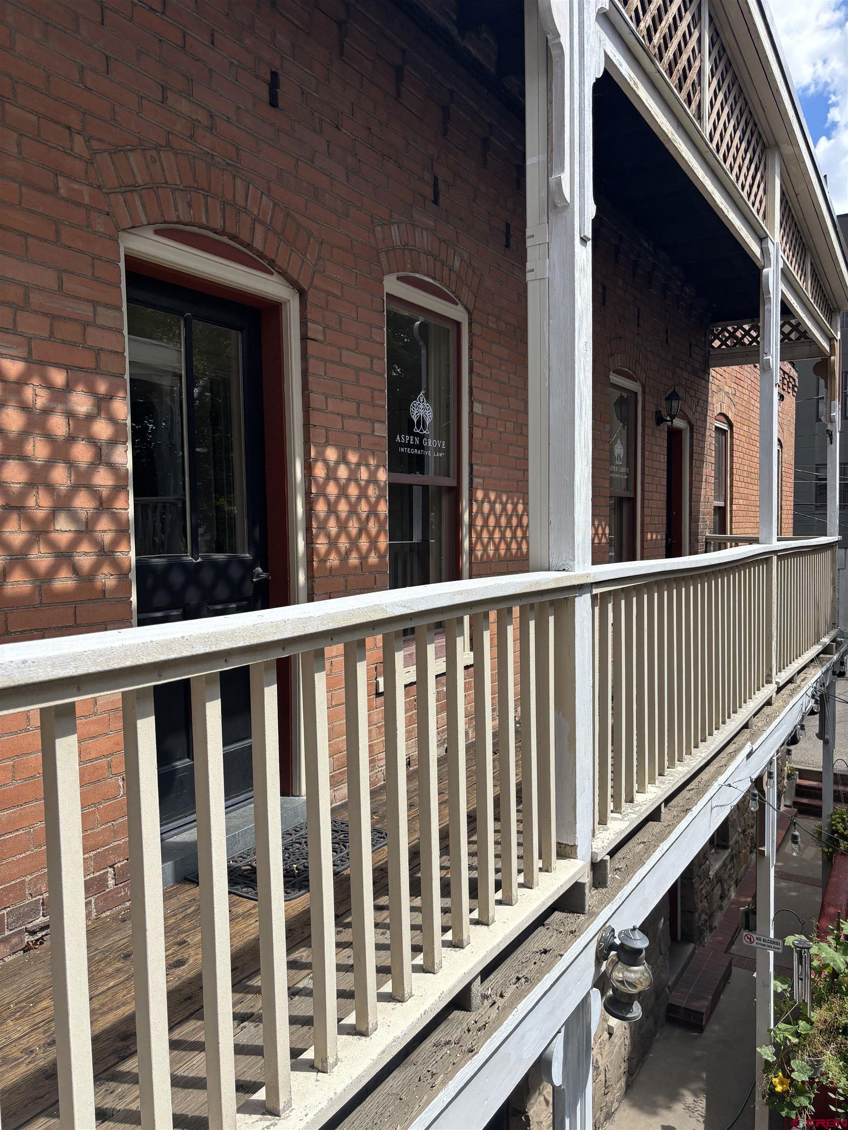 552 Main Avenue, Unit B Durango, CO 81301 - Photo 1 of 12 a view of a brick house with a window