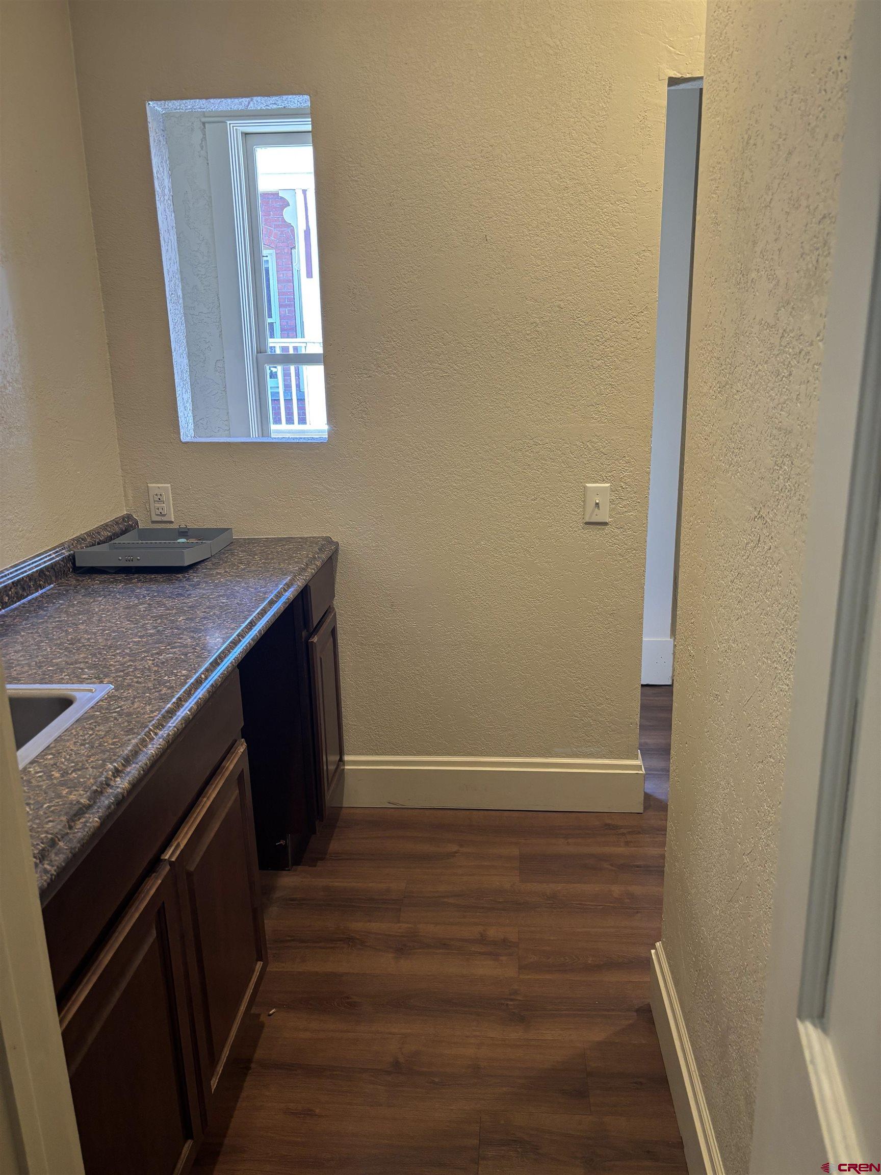 552 Main Avenue, Unit B Durango, CO 81301 - Photo 5 of 12 a kitchen with a sink and a mirror
