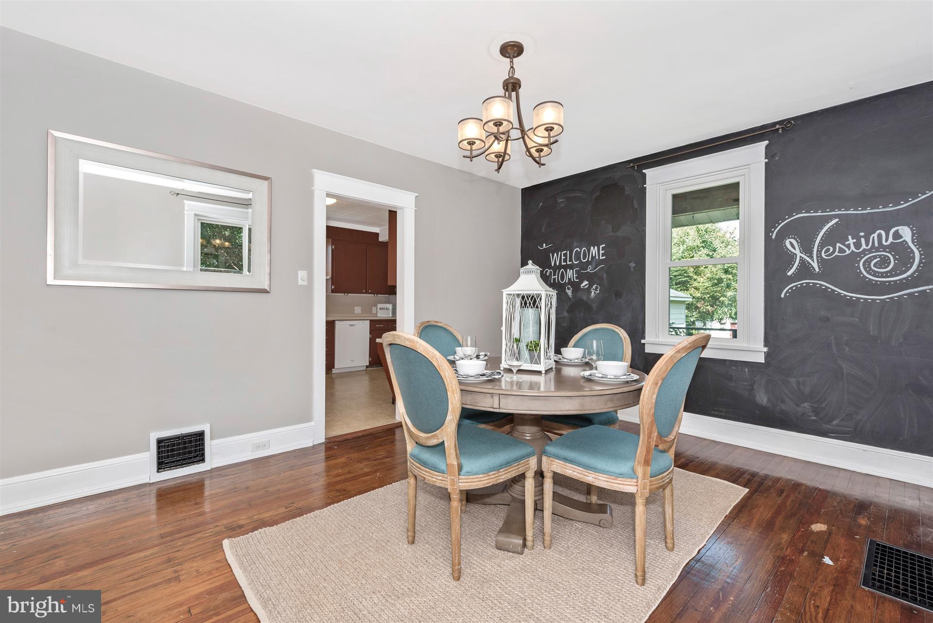 317 Avon Road Hagerstown, MD 21740 - Photo 12 of 30 a view of a dining room with furniture window and wooden floor