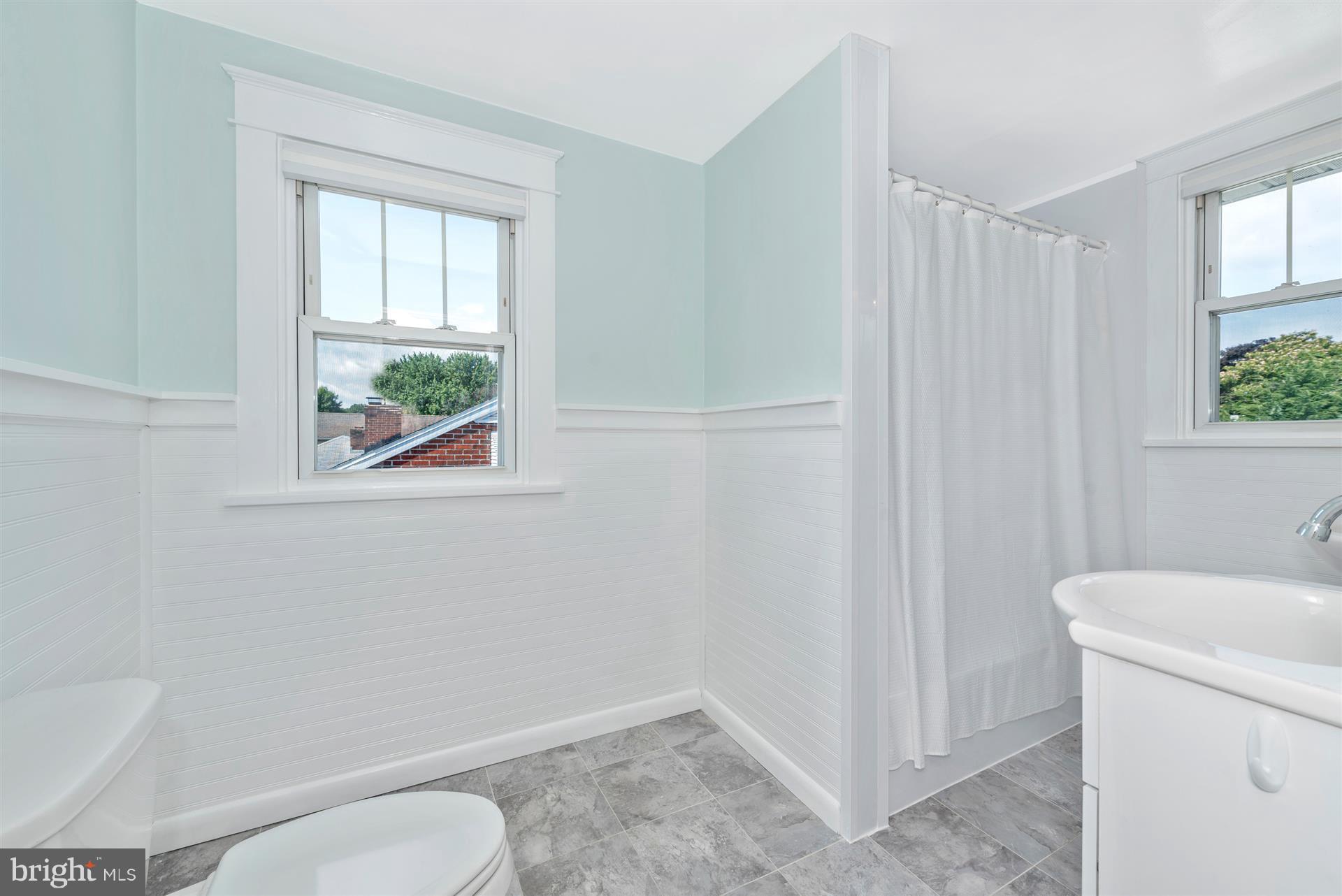 317 Avon Road Hagerstown, MD 21740 - Photo 25 of 30 a bathroom with a toilet a sink and a window