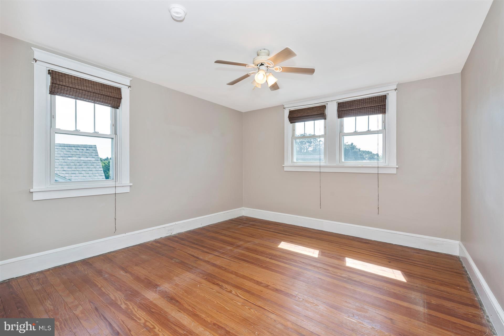 317 Avon Road Hagerstown, MD 21740 - Photo 26 of 30 a view of an empty room with wooden floor and a window