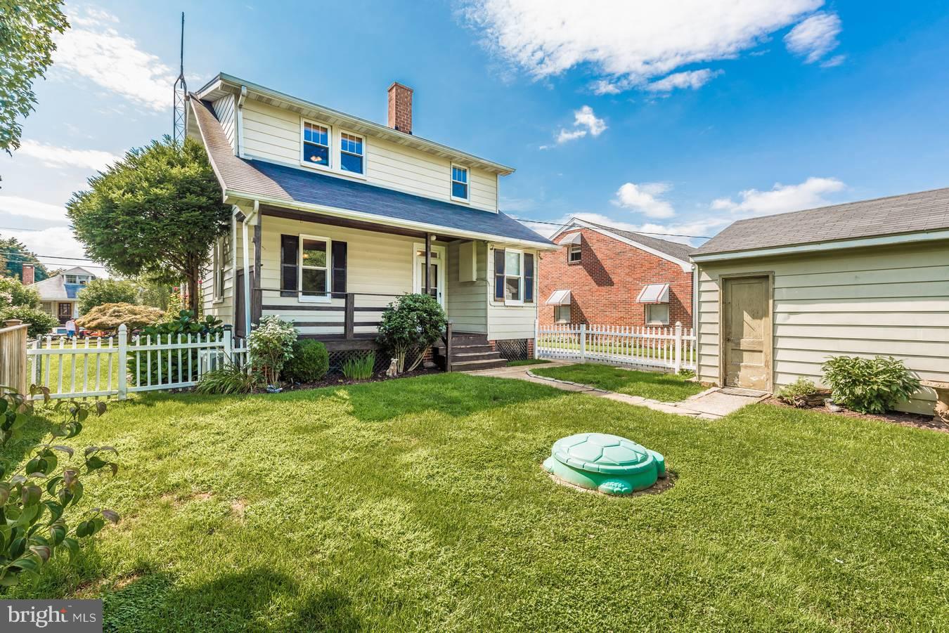 317 Avon Road Hagerstown, MD 21740 - Photo 28 of 30 a front view of a house with a yard table and chairs