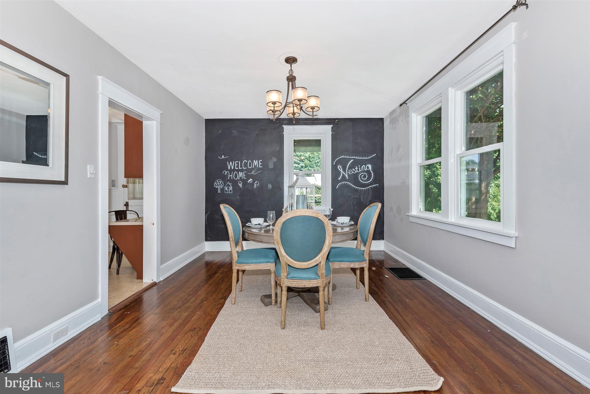 317 Avon Road Hagerstown, MD 21740 - Photo 9 of 30 a dining room with chandelier fan and wooden floor