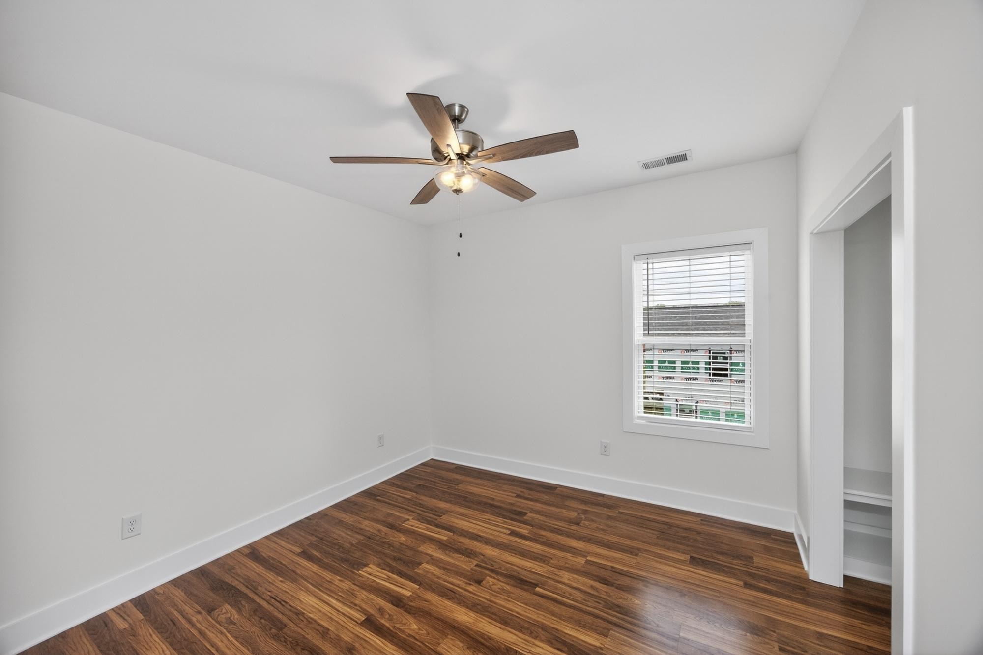 7 Decatur Street Nashville, TN 37210 - Photo 31 of 43 wooden floor in an empty room with a window
