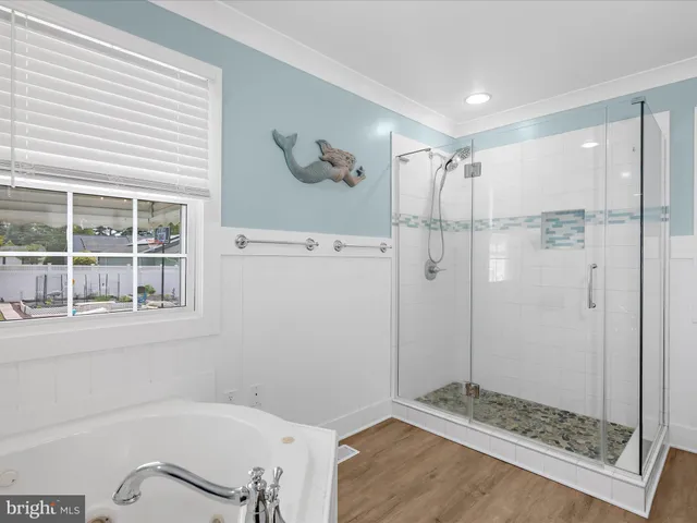 a bedroom with a bed and a dresser in it