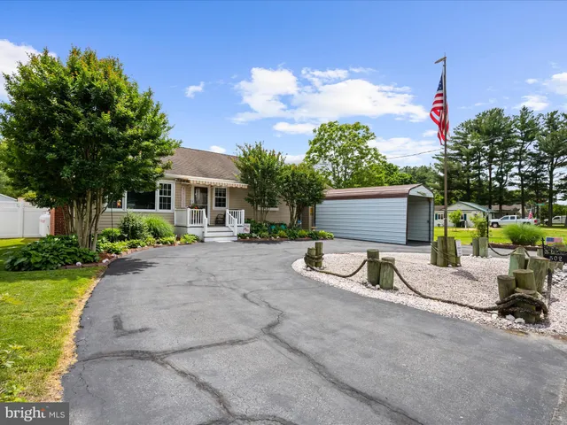 a view of a chair and tables in the patio