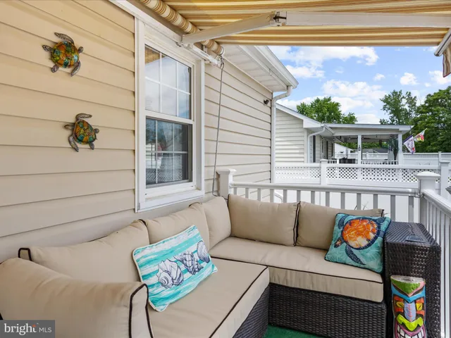 a view of a house with swimming pool and sitting area